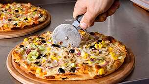 Pizza being cut